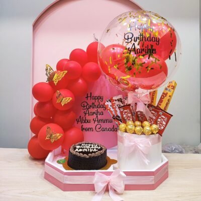 Chocolate Cake with Assorted Chocolates and Red Balloons